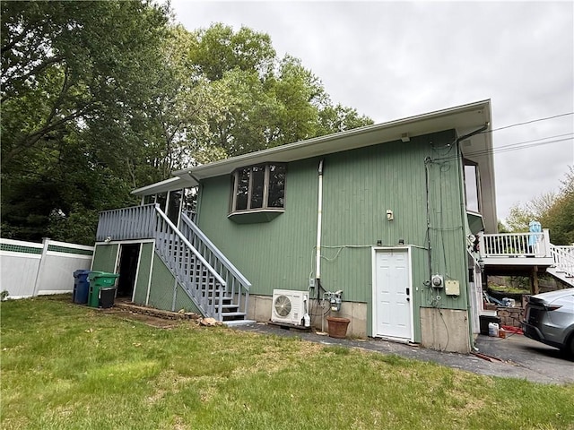 3945 Post Rd, Warwick, RI 02886 - rear view of property with stairs, a cooling unit, and a wooden deck