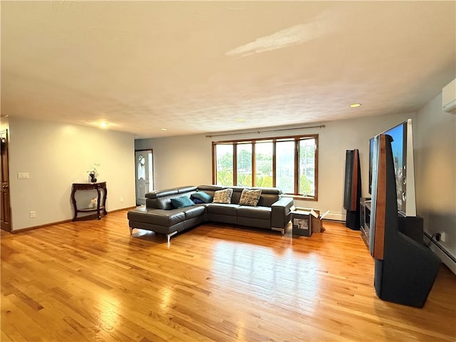 3945 Post Rd, Warwick, RI 02886 - living room with light wood finished floors, recessed lighting, baseboards, and a baseboard radiator