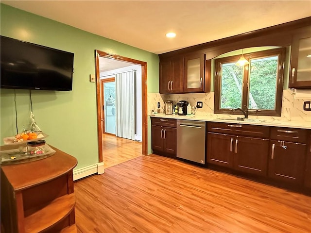 3945 Post Rd, Warwick, RI 02886 - kitchen featuring dishwasher, a sink, light wood-style flooring, tasteful backsplash, and dark brown cabinetry