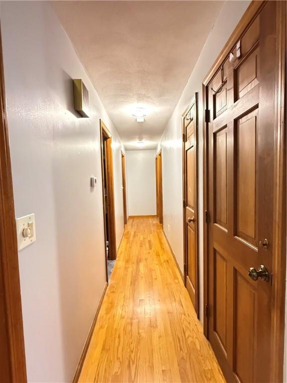 3945 Post Rd, Warwick, RI 02886 - corridor with light wood-style flooring