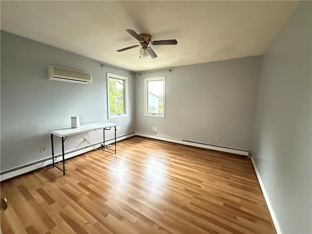 3945 Post Rd, Warwick, RI 02886 - unfurnished room with a wall unit AC, a ceiling fan, wood finished floors, and baseboards