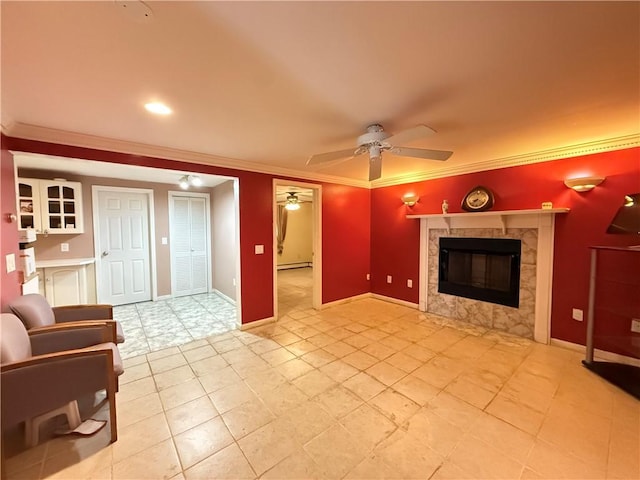 3945 Post Rd, Warwick, RI 02886 - living area with ceiling fan, crown molding, a high end fireplace, light tile patterned floors, and baseboards