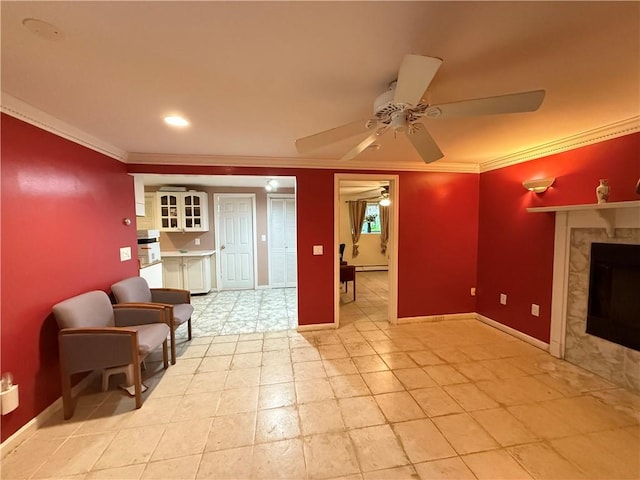 3945 Post Rd, Warwick, RI 02886 - living room with ceiling fan, ornamental molding, a fireplace, baseboards, and a baseboard heating unit