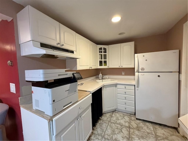3945 Post Rd, Warwick, RI 02886 - kitchen with freestanding refrigerator, under cabinet range hood, a sink, light countertops, and recessed lighting