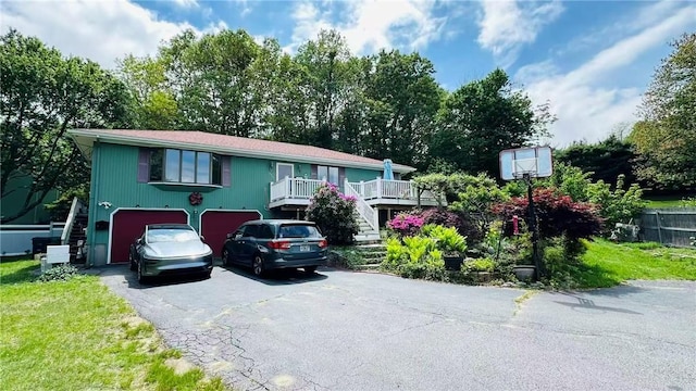 3945 Post Rd, Warwick, RI 02886 - view of front of house featuring stairway, driveway, and an attached garage