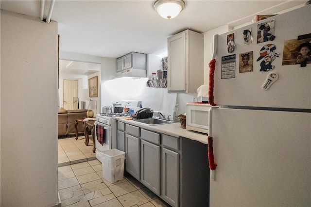15 Ruggles St, Providence, RI 02908 - kitchen with white appliances, gray cabinetry, a sink, light tile patterned flooring, and light countertops