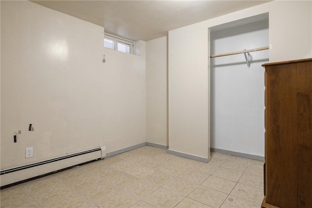 15 Ruggles St, Providence, RI 02908 - unfurnished bedroom with baseboard heating, light tile patterned floors, baseboards, and a closet