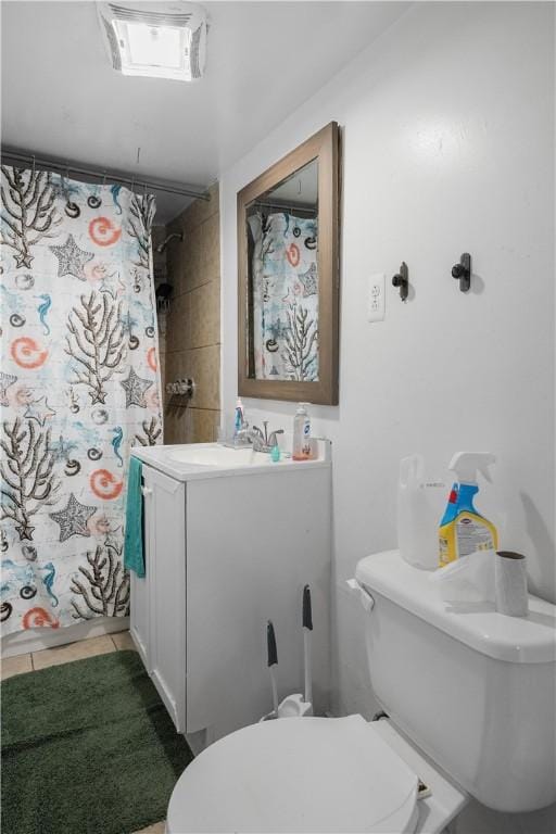 15 Ruggles St, Providence, RI 02908 - full bath featuring toilet, vanity, tile patterned floors, and a shower with curtain