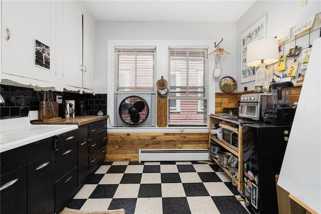 43 Chapin Ave Unit 3, Providence, RI 02909 - laundry room featuring a baseboard heating unit and tile patterned floors