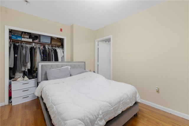 22 Myrtle St, Pawtucket, RI 02860 - bedroom featuring a closet, baseboards, and wood finished floors