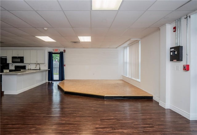 413 High St, Bristol, RI 02809 - unfurnished living room with dark wood-style flooring and a paneled ceiling