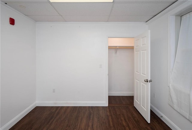 413 High St, Bristol, RI 02809 - unfurnished bedroom with a drop ceiling, wood finished floors, and a walk in closet