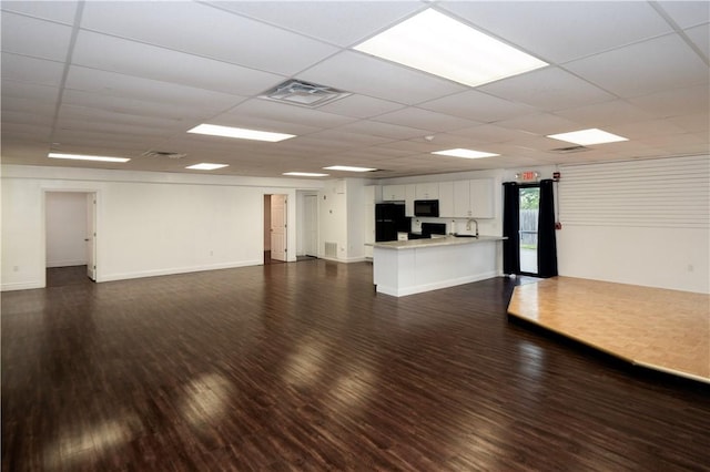 413 High St, Bristol, RI 02809 - unfurnished living room with dark wood finished floors and a paneled ceiling
