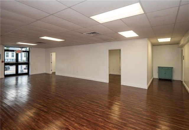 413 High St, Bristol, RI 02809 - spare room with dark wood finished floors, a paneled ceiling, and french doors