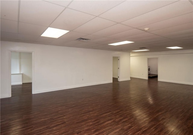 413 High St, Bristol, RI 02809 - empty room with dark wood finished floors, a drop ceiling, and a smoke detector