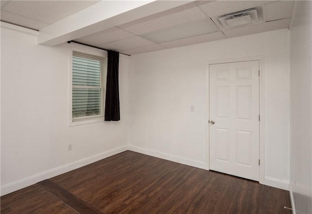 413 High St, Bristol, RI 02809 - empty room featuring dark wood-style flooring and a paneled ceiling