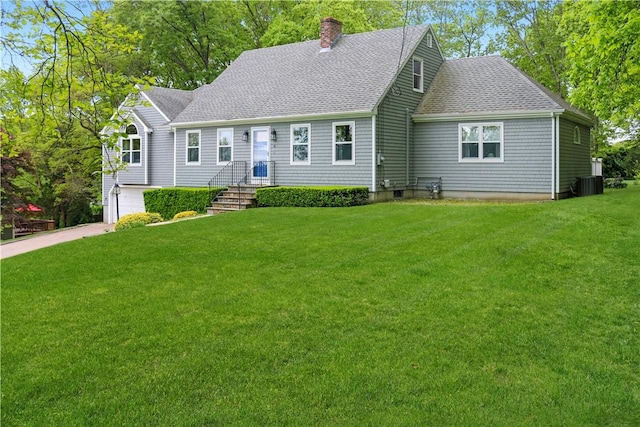 6 Forrestal Dr, Westerly, RI 02891 - view of front of property with a chimney, roof with shingles, a front lawn, a garage, and driveway