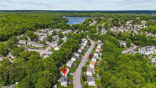 15 Lawnacre Dr, North Providence, RI 02911 - aerial view of property and surrounding area featuring a heavily wooded area, a large body of water, and nearby suburban area