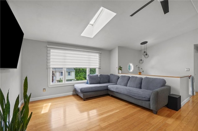 15 Lawnacre Dr, North Providence, RI 02911 - living area with light wood-style flooring, a skylight, ceiling fan, and baseboards