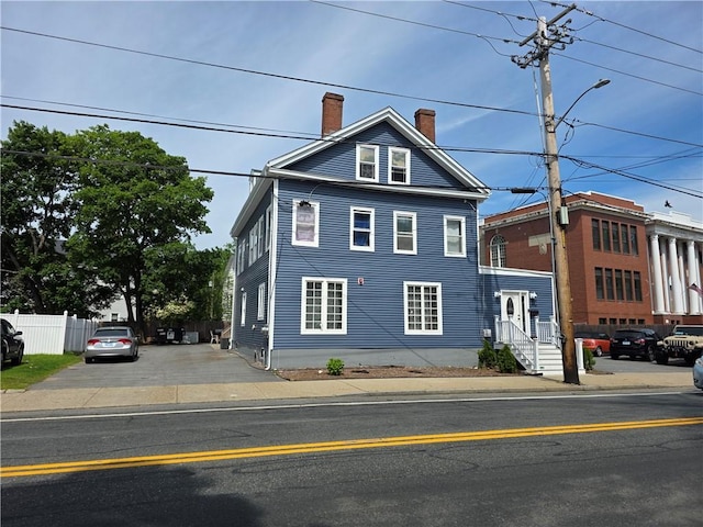 1612 Lonsdale Ave, Lincoln, RI 02865 - view of front of house featuring a chimney