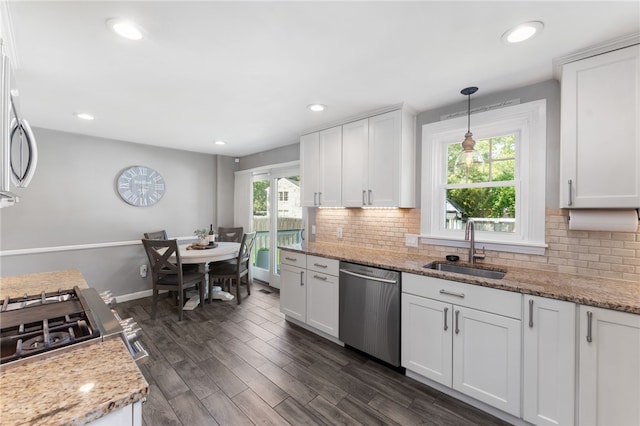 23 Revere St, Pawtucket, RI 02861 - kitchen featuring dishwasher, a sink, white cabinetry, tasteful backsplash, and recessed lighting