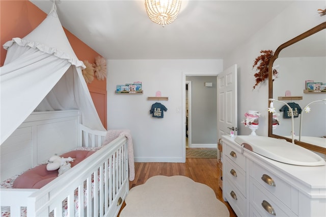 23 Revere St, Pawtucket, RI 02861 - bedroom with a sink, light wood-type flooring, and baseboards