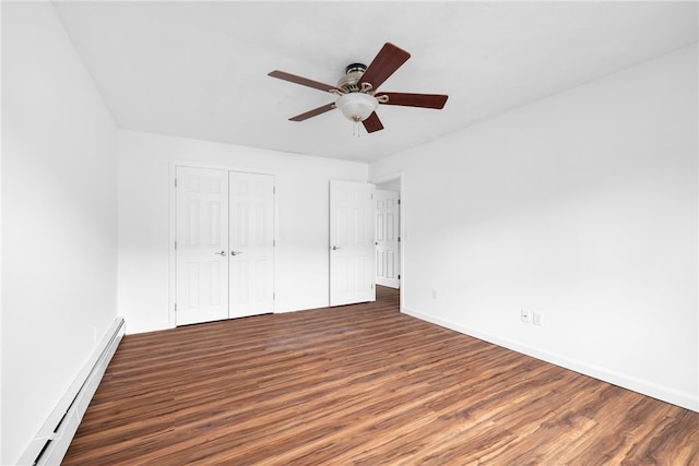 123 Forestwood Dr, North Providence, RI 02904 - unfurnished bedroom featuring baseboard heating, wood finished floors, baseboards, and a closet