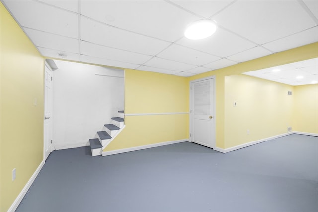 123 Forestwood Dr, North Providence, RI 02904 - finished below grade area with a paneled ceiling, baseboards, and stairs
