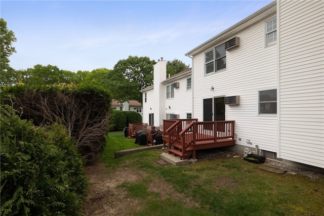 123 Forestwood Dr, North Providence, RI 02904 - rear view of house featuring a wooden deck, a yard, a wall mounted air conditioner, and a chimney