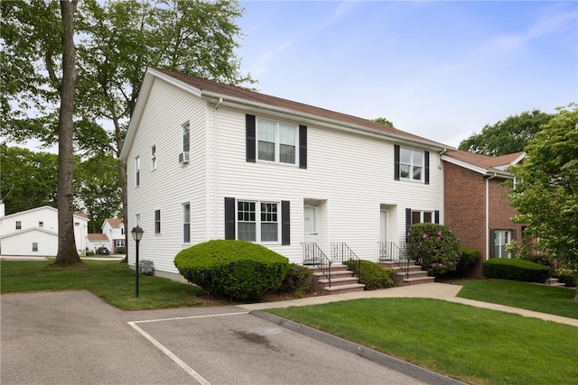 123 Forestwood Dr, North Providence, RI 02904 - colonial house featuring uncovered parking and a front lawn