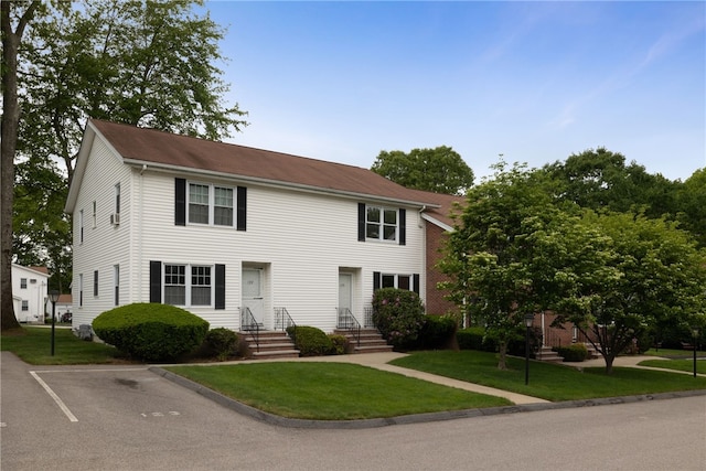 123 Forestwood Dr, North Providence, RI 02904 - colonial house featuring uncovered parking and a front yard