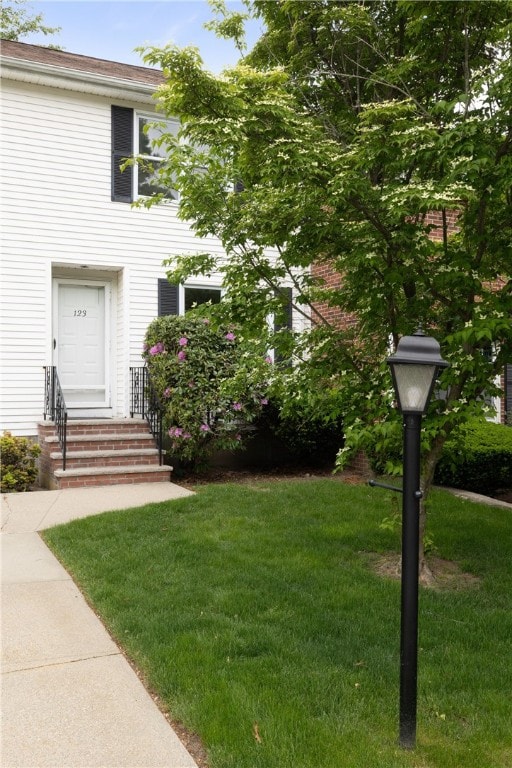 123 Forestwood Dr, North Providence, RI 02904 - property entrance featuring a lawn