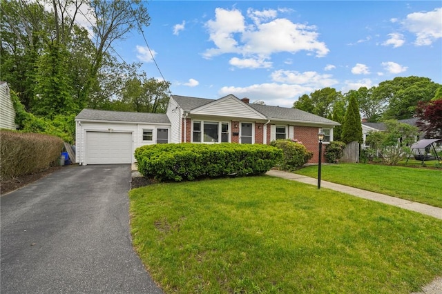 156 Davis Ave, Cranston, RI 02910 - view of front of house featuring a garage, asphalt driveway, a front yard, and brick siding