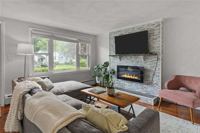 156 Davis Ave, Cranston, RI 02910 - living area featuring wood finished floors, baseboard heating, a fireplace, and a baseboard heating unit