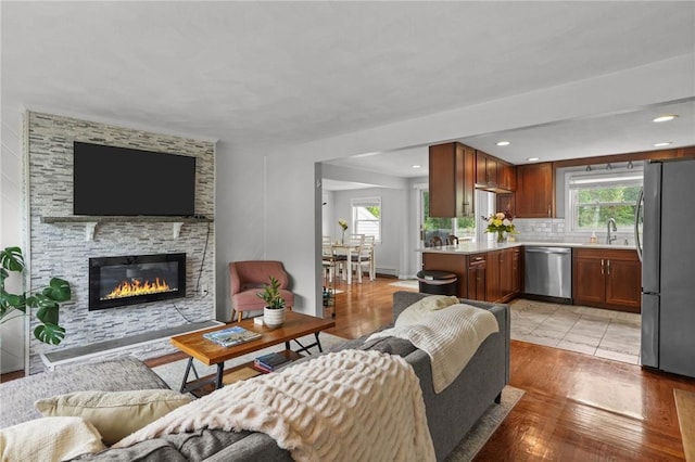 156 Davis Ave, Cranston, RI 02910 - living area with a fireplace and light wood-style flooring