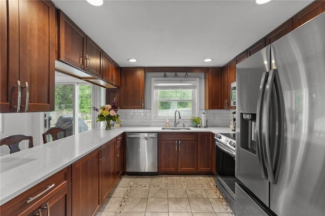 156 Davis Ave, Cranston, RI 02910 - kitchen featuring stainless steel appliances, a sink, recessed lighting, light countertops, and decorative backsplash