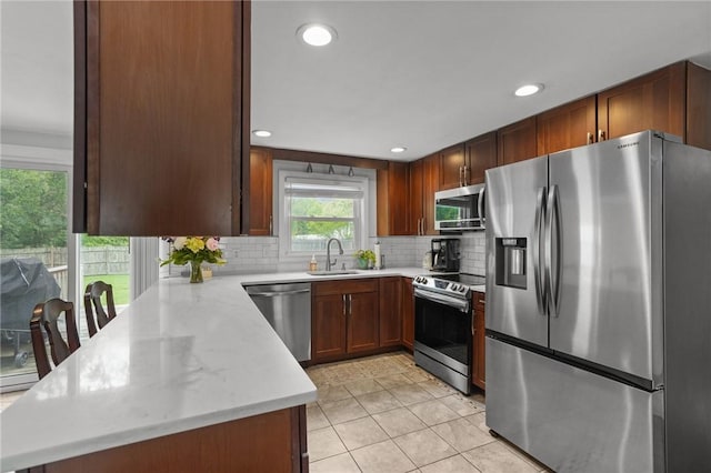 156 Davis Ave, Cranston, RI 02910 - kitchen featuring appliances with stainless steel finishes, a sink, tasteful backsplash, recessed lighting, and light tile patterned floors