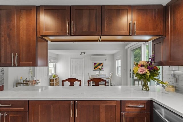 156 Davis Ave, Cranston, RI 02910 - kitchen featuring stainless steel dishwasher, a peninsula, plenty of natural light, and backsplash