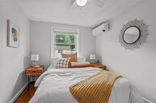 156 Davis Ave, Cranston, RI 02910 - bedroom with a wall mounted air conditioner, baseboards, dark wood finished floors, and a ceiling fan