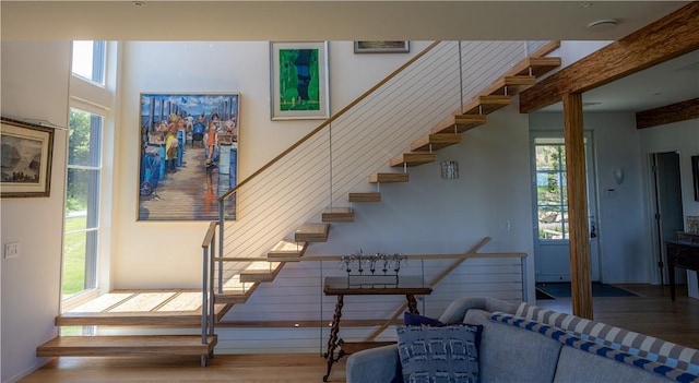 1448 Mohegan Trl, Block Island, RI 02807 - staircase featuring wood finished floors, plenty of natural light, and beamed ceiling