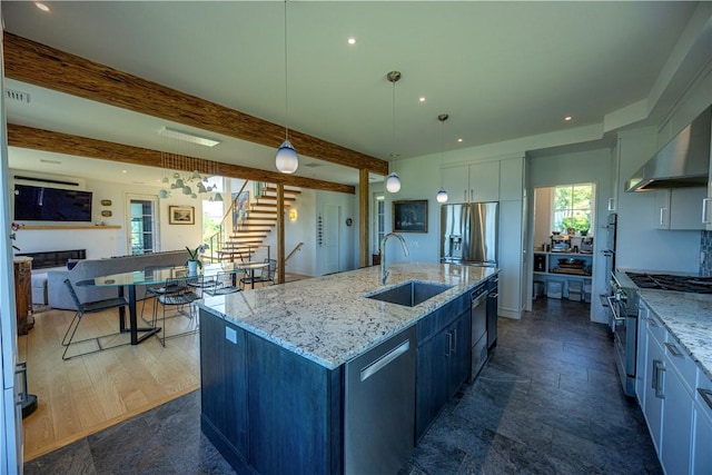 1448 Mohegan Trl, Block Island, RI 02807 - kitchen featuring a sink, stainless steel appliances, pendant lighting, a large island, and beam ceiling