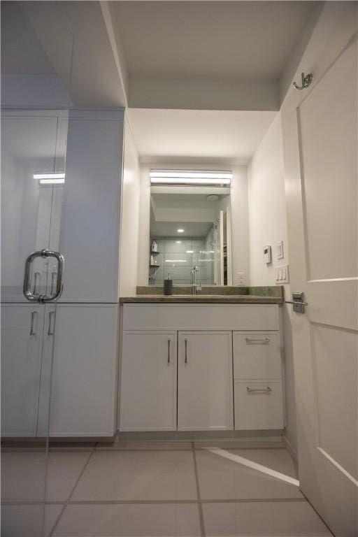 1448 Mohegan Trl, Block Island, RI 02807 - bathroom featuring vanity, tile patterned flooring, and a shower stall