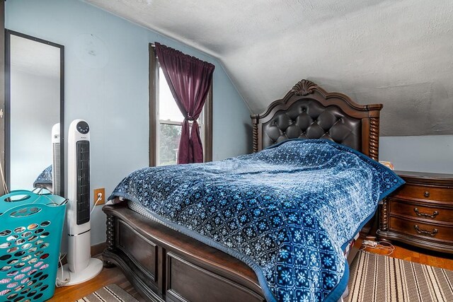 85 Herschel St, Providence, RI 02909 - bedroom featuring lofted ceiling, wood finished floors, and a textured ceiling