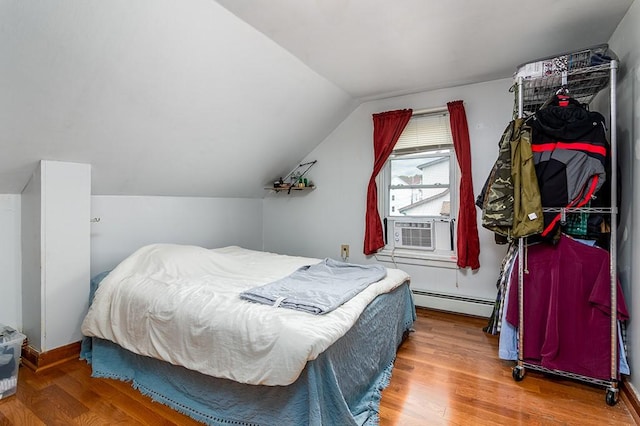 85 Herschel St, Providence, RI 02909 - bedroom with baseboard heating, wood finished floors, cooling unit, lofted ceiling, and baseboards