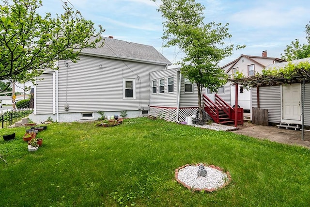 85 Herschel St, Providence, RI 02909 - rear view of property featuring a yard and entry steps
