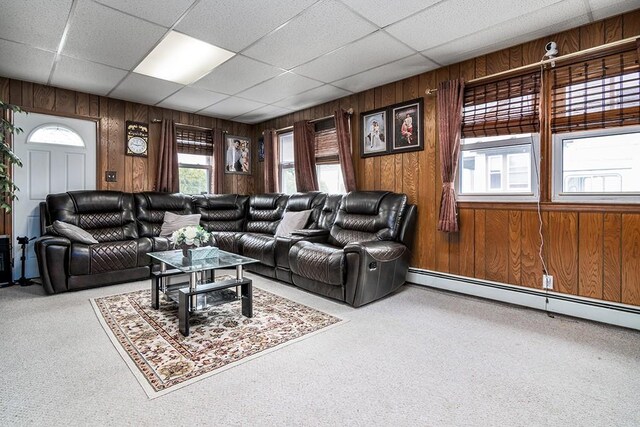 85 Herschel St, Providence, RI 02909 - living area featuring a baseboard radiator, carpet floors, wood walls, and a drop ceiling