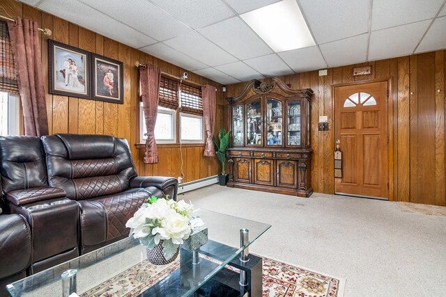85 Herschel St, Providence, RI 02909 - living area featuring wooden walls, a baseboard radiator, and carpet flooring