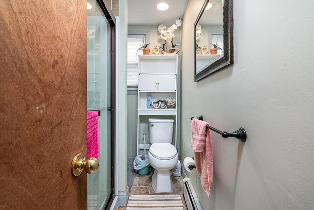 85 Herschel St, Providence, RI 02909 - bathroom featuring toilet, an enclosed shower, and a baseboard heating unit