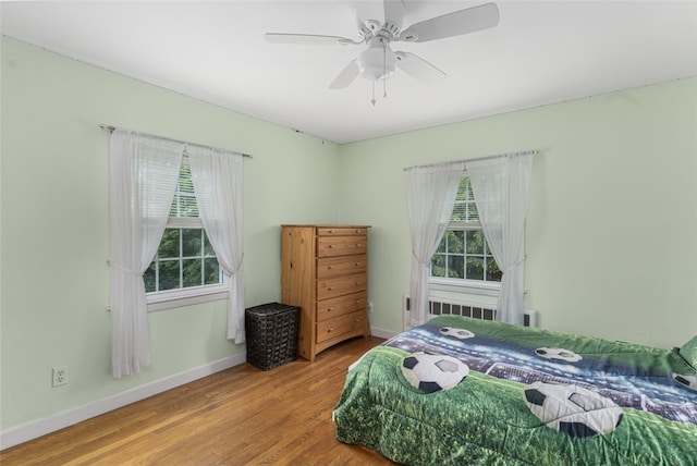 15 Metcalf Dr, Cumberland, RI 02864 - bedroom featuring multiple windows, wood finished floors, and a ceiling fan