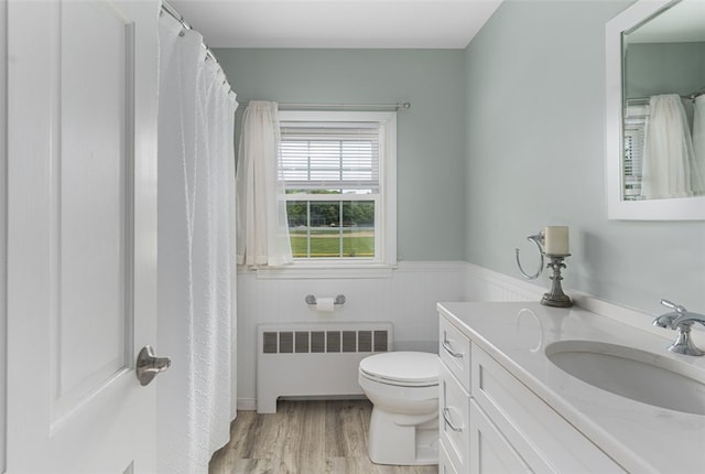 15 Metcalf Dr, Cumberland, RI 02864 - full bathroom with radiator heating unit, vanity, wood finished floors, and wainscoting